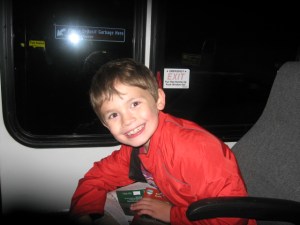 On the bus on the way home. They said this bus was like the airplane but without wings and on the ground.